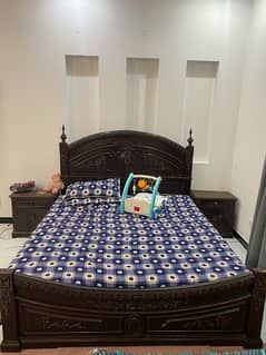 wooden bed with dressing