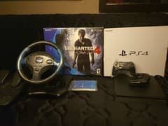 Ps4 slim with 2 original controllers and steering wheel