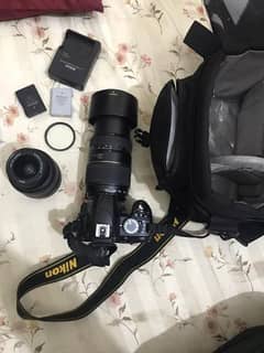 10 by 10 fresh camera  2 Lenses and 2 Nikon betteries and  charger 0