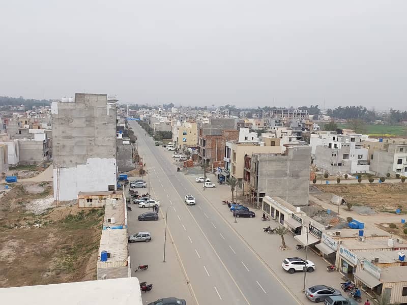 5 MARLA COMMERCIAL CORNER PLOT WITH POSSESSION MAIN 80 FEET ROAD WITH 30 FEET PARKING IN AL KABIR TOWN PHASE 2 CLOCK A 5