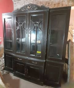 good condition kitchen cabinet with glass. dark brown furniture color