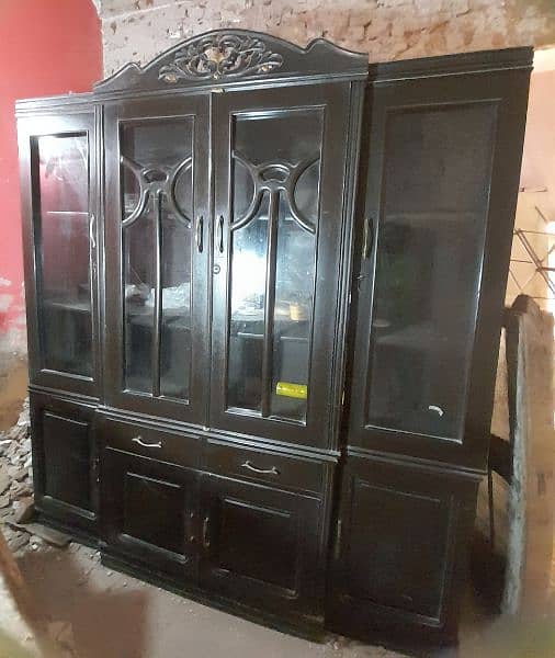 good condition kitchen cabinet with glass. dark brown furniture color 0