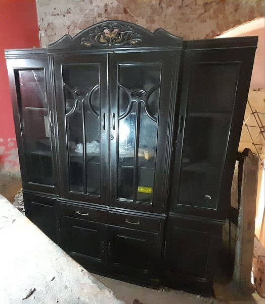 good condition kitchen cabinet with glass. dark brown furniture color 1