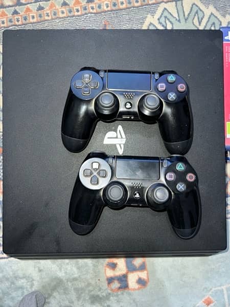 ps4 pro with 2 controllers and 2 games:spiderman and days gone 2