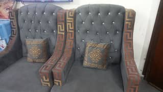 2 sofa chairs with mirror table