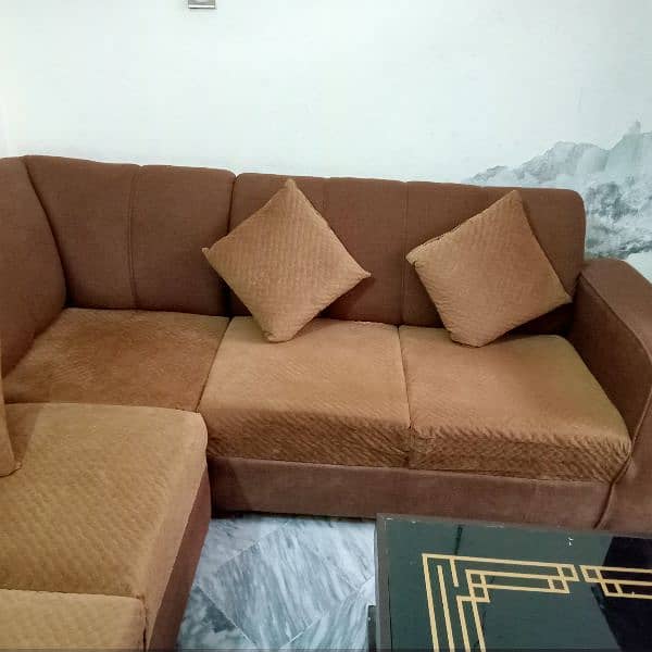 L shaped sofa with cushions and table 2