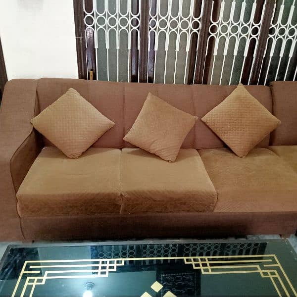 L shaped sofa with cushions and table 3