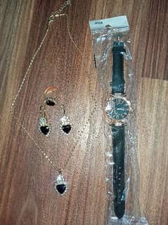 Beautiful Artificial Chain Earrings and ring With Women's watch.