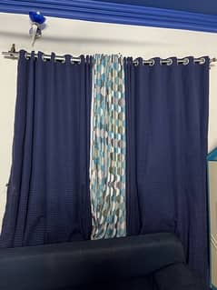 blue and aky blue curtains in a goid condition