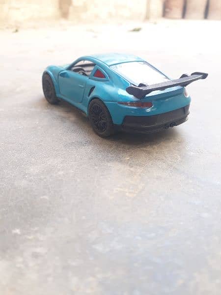 Porcshe 911 toy car in blue colour 1