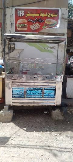 steel counter with two ss fryer 1 electric fryer and hote plate