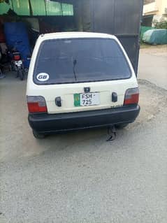 White Suzuki mehran with new tyres and alloyrims