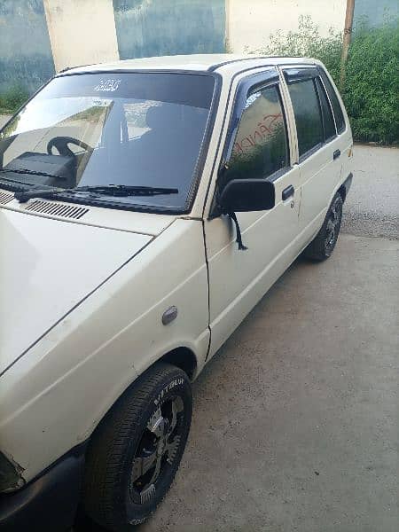White Suzuki mehran with new tyres and alloyrims 6