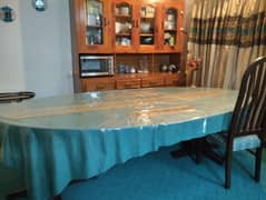 Eight seater,  wooden, oval shaped dinning table for sale 0
