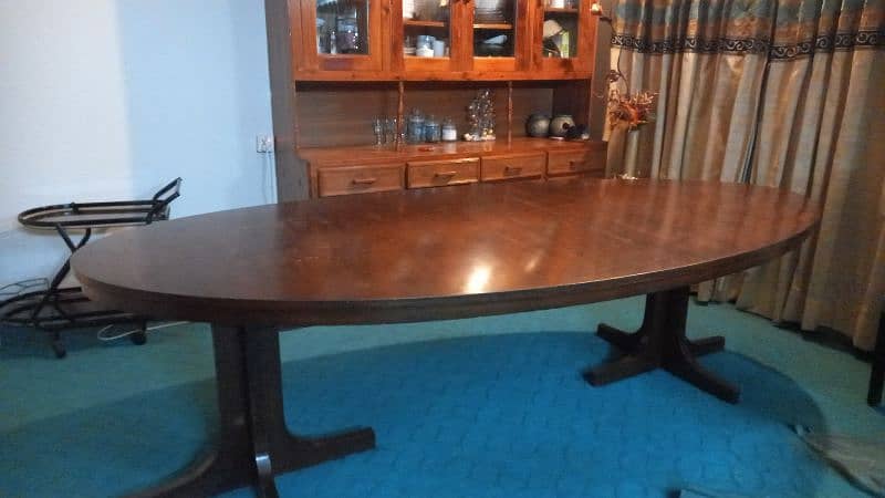 Eight seater,  wooden, oval shaped dinning table for sale 5