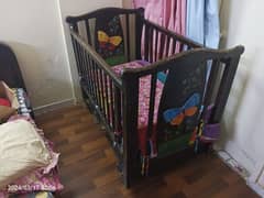 wooden baby / toddler cot bed available in used condition