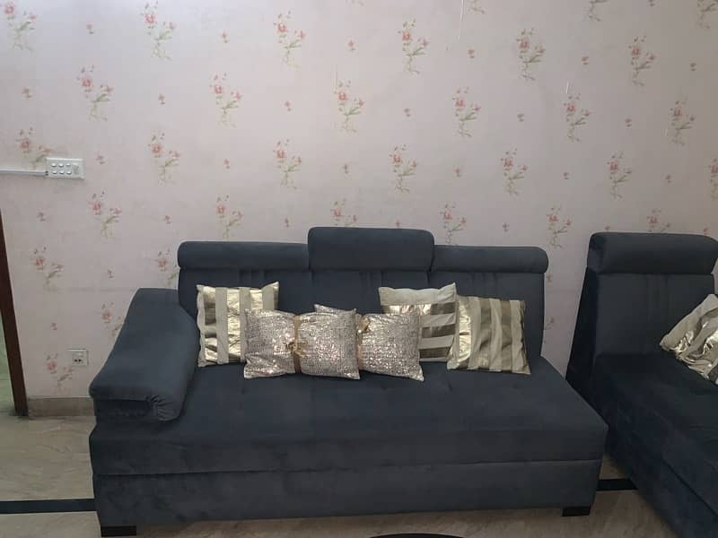 L shaped sofa in grey colour 1