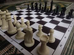 Chess Board with huge pieces and sheet.
