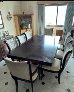 solid wood dining table with 8 chairs.
