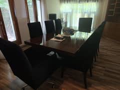 dining table with chairs and cupboard.