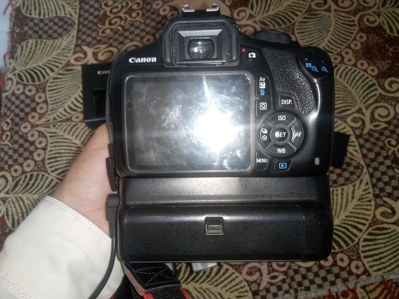 Canon 1200D Dslr Camera. 10.8 condition. 3 battery. battery grip . 5