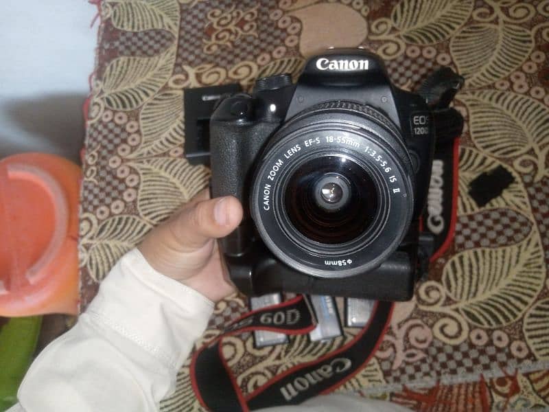 Canon 1200D Dslr Camera. 10.8 condition. 3 battery. battery grip . 7