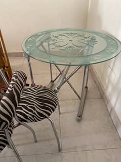 modern dinning ; iron stand with glass table and four chairs for sale