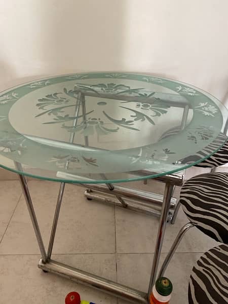 modern dinning ; iron stand with glass table and four chairs for sale 5