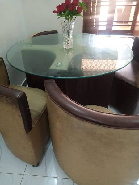 Circular Glass top dining table 1