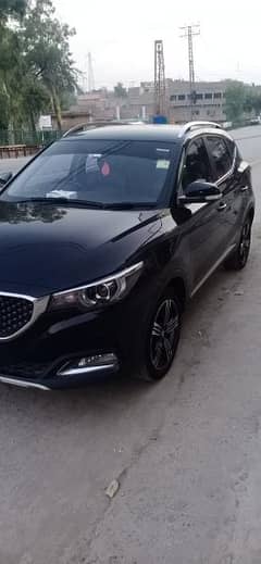 i want to sell my car Mg zs black color islamabad reg golden number 0