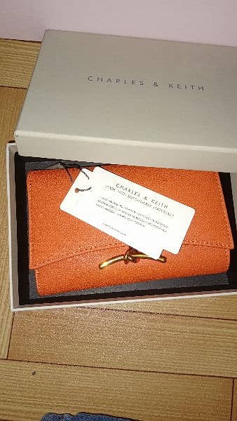 Charles and Keith huxley metallic-accent front flap wallet - orange 5