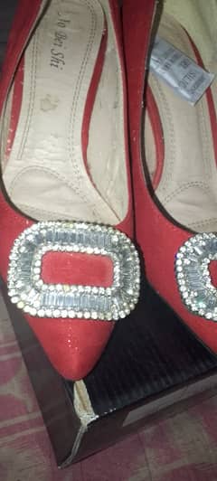 Bridal red glittery shoes with silver buckel