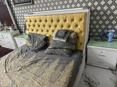 king size bed with two side tables and dressing