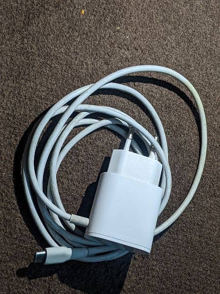 Universal 20W charger with attached C type wire . 2