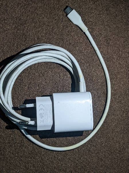 Universal 20W charger with attached C type wire . 3