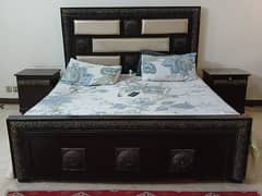 bed with side tables and dressing table