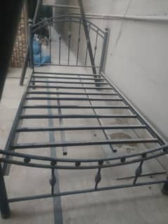 Iron bed with a 3-year-old mattress.
