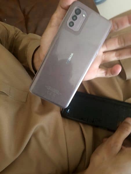 Nokia G21 mobile ha 4/128may tora sa uper say Kara tota Howa ha 1