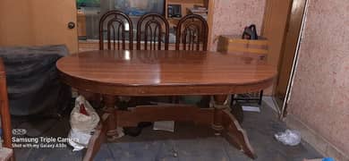wooden dining table with six chairs in excellent condition