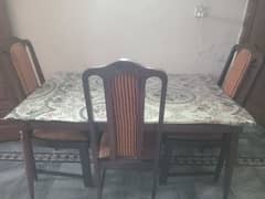 woden daing table with 3 chairs