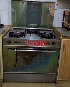 Full size Gas oven with grill and three stoves on top negotiable price
