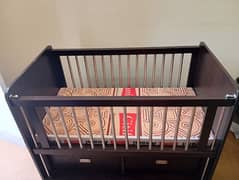 wooden baby cot with foam for sale.