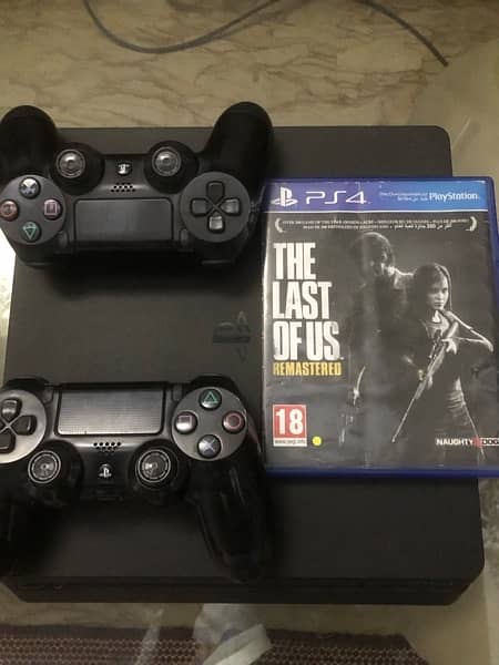 PS4 1TB with two controllers and one Game 3