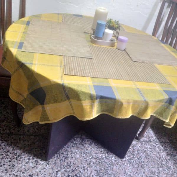 four men round dining table in immaculate condition. 1