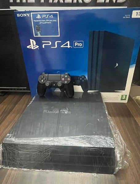 Playstation 4 pro 1 TB with Boxes 11