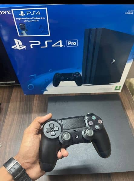 Playstation 4 pro 1 TB with Boxes 12