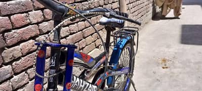 Bicycle in blue with stickers 0