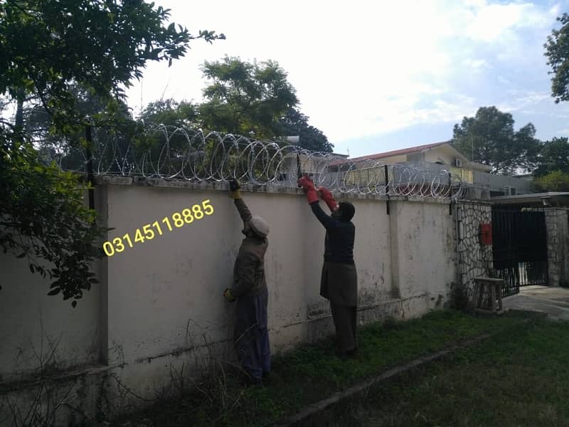 Secure Home with Razor Wire, Chainlink Fence, Concertina Barbed wire 10