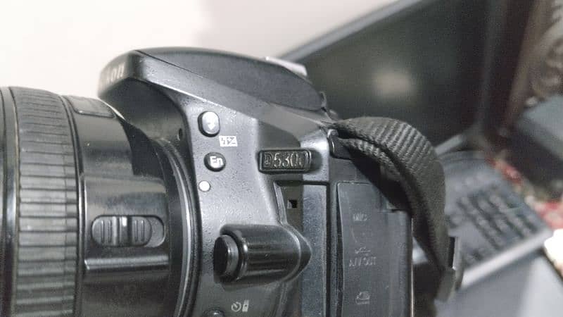 Nikon D5300 with lens 18 140 3