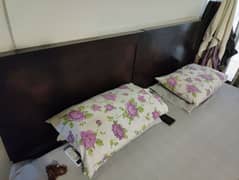 Two single beds without side tables